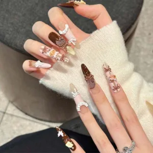Home 2 A set of handmade nail studs in various elegant designs, perfect for adding a sophisticated touch to your nail art.