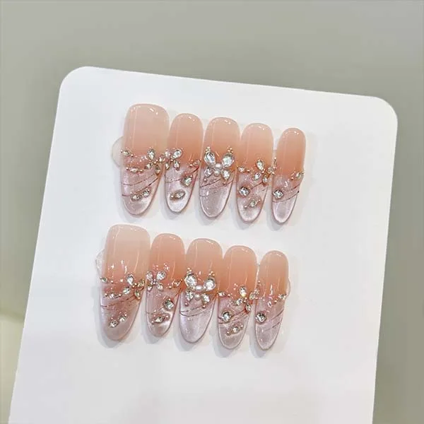 A set of handmade nail studs in various elegant designs, perfect for adding a sophisticated touch to your nail art.