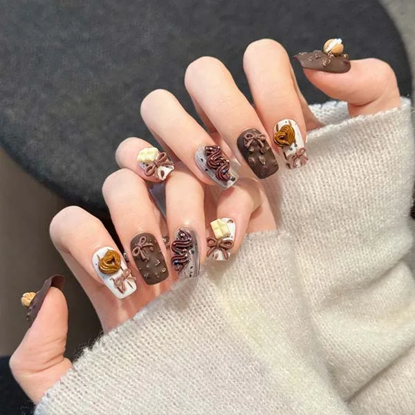 A set of handmade nail studs in various elegant designs, perfect for adding a sophisticated touch to your nail art.