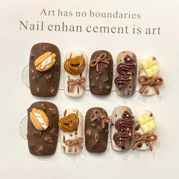 A set of handmade nail studs in various elegant designs, perfect for adding a sophisticated touch to your nail art.