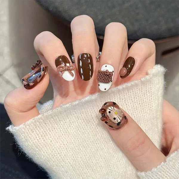 A set of handmade nail studs in various elegant designs, perfect for adding a sophisticated touch to your nail art.