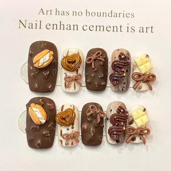 A set of handmade nail studs in various elegant designs, perfect for adding a sophisticated touch to your nail art.