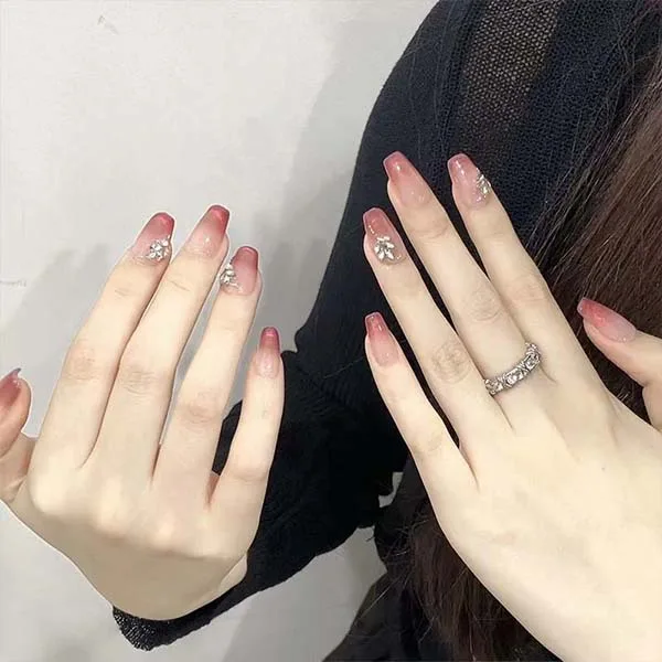 A set of handmade nail studs in various elegant designs, perfect for adding a sophisticated touch to your nail art.