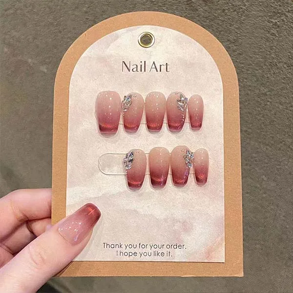 A set of handmade nail studs in various elegant designs, perfect for adding a sophisticated touch to your nail art.