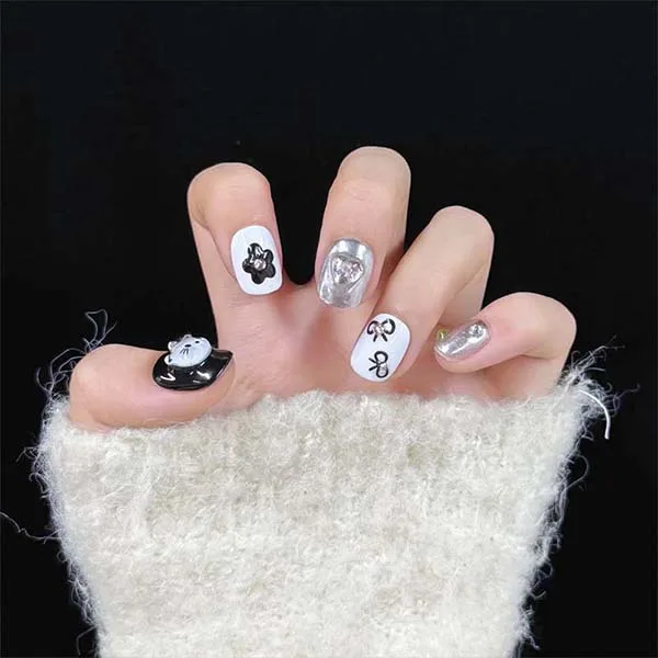 A set of handmade nail studs in various elegant designs, perfect for adding a sophisticated touch to your nail art.