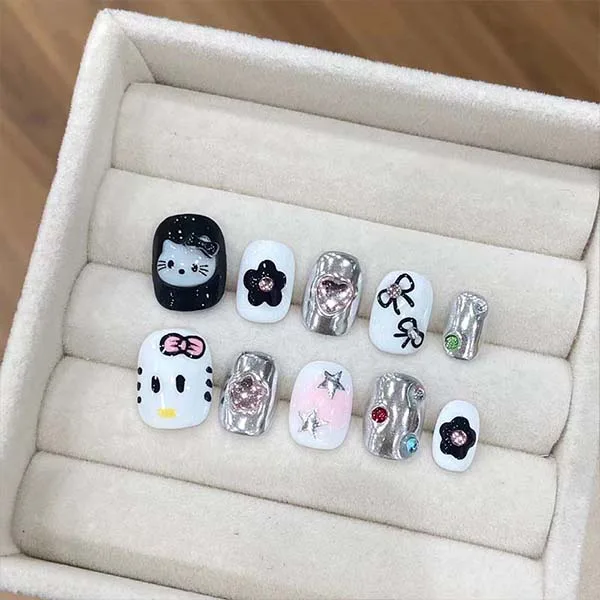 A set of handmade nail studs in various elegant designs, perfect for adding a sophisticated touch to your nail art.