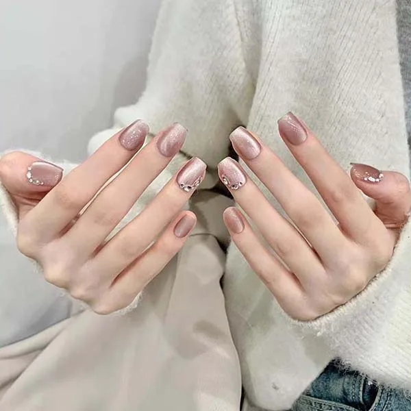 A set of handmade nail studs in various elegant designs, perfect for adding a sophisticated touch to your nail art.