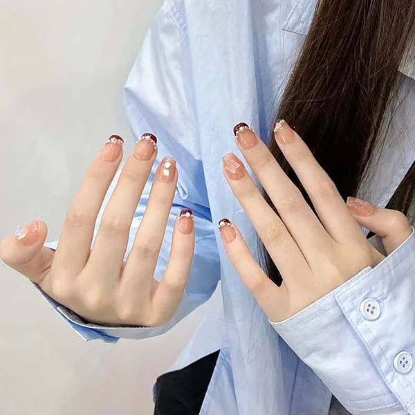 A set of handmade nail studs in various elegant designs, perfect for adding a sophisticated touch to your nail art.