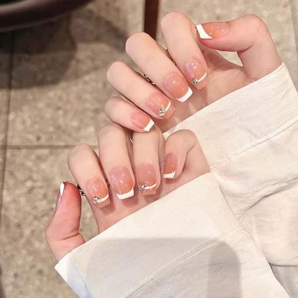 A set of handmade nail studs in various elegant designs, perfect for adding a sophisticated touch to your nail art.