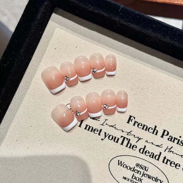 A set of handmade nail studs in various elegant designs, perfect for adding a sophisticated touch to your nail art.