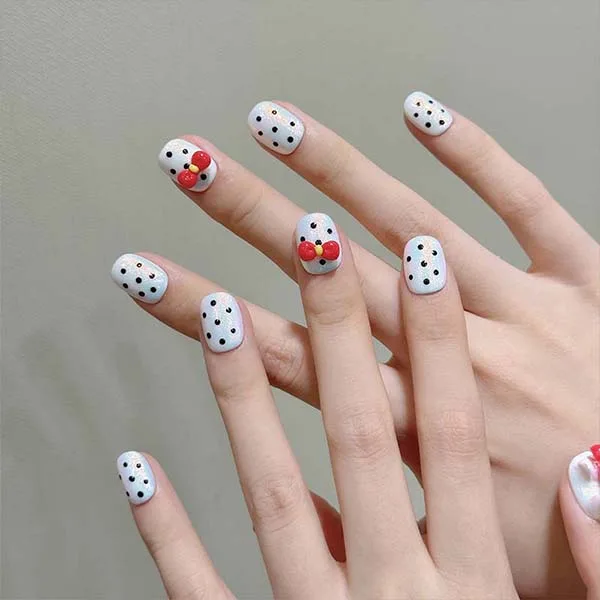 A set of handmade nail studs in various elegant designs, perfect for adding a sophisticated touch to your nail art.