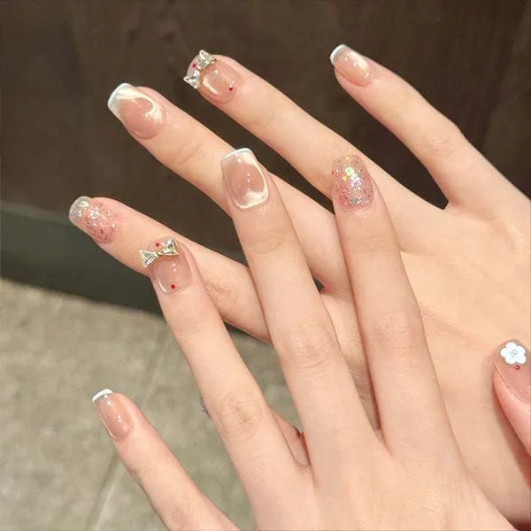 A set of handmade nail studs in various elegant designs, perfect for adding a sophisticated touch to your nail art.