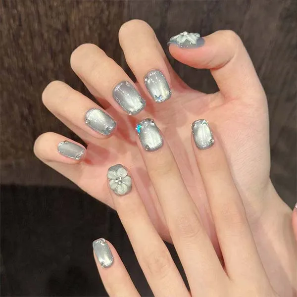 A set of handmade nail studs in various elegant designs, perfect for adding a sophisticated touch to your nail art.