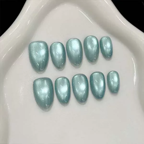 A set of handmade nail studs in various elegant designs, perfect for adding a sophisticated touch to your nail art.