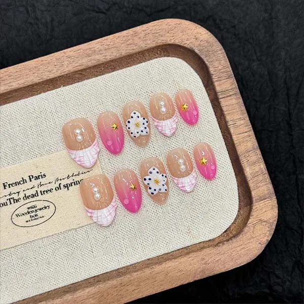 A set of handmade nail studs in various elegant designs, perfect for adding a sophisticated touch to your nail art.