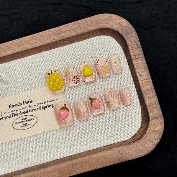 A set of handmade nail studs in various elegant designs, perfect for adding a sophisticated touch to your nail art.