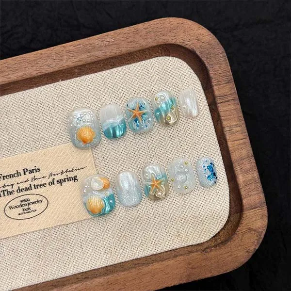 Close-up of custom-made handmade nail studs, designed to elevate the look of your nails with exquisite craftsmanship.