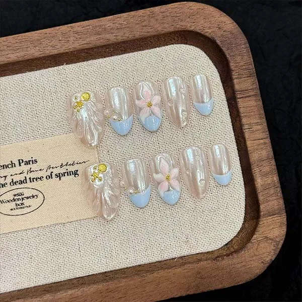 A set of handmade nail studs in various elegant designs, perfect for adding a sophisticated touch to your nail art.
