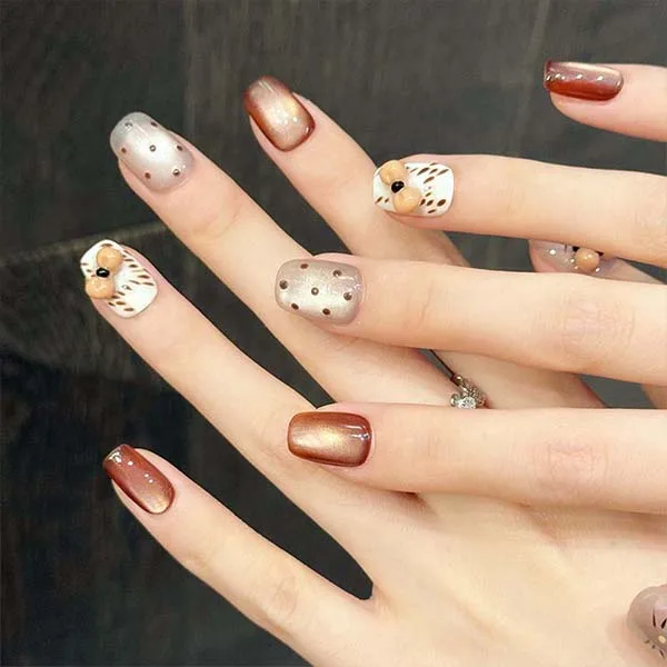 A set of handmade nail studs in various elegant designs, perfect for adding a sophisticated touch to your nail art.