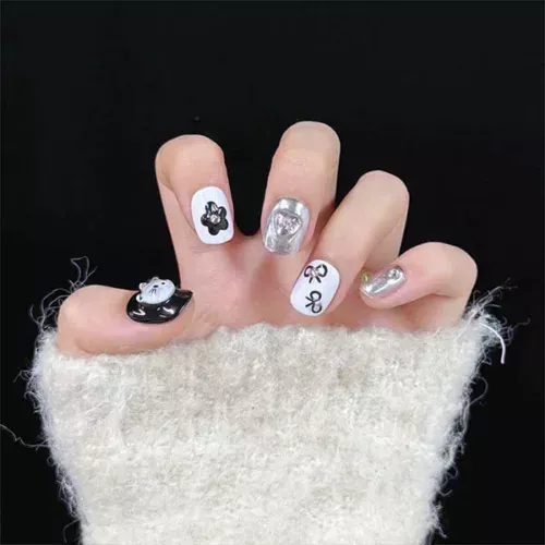 A set of handmade nail studs in various elegant designs, perfect for adding a sophisticated touch to your nail art.