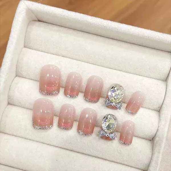 A set of handmade nail studs in various elegant designs, perfect for adding a sophisticated touch to your nail art.