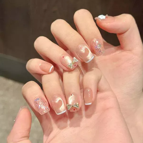 A set of handmade nail studs in various elegant designs, perfect for adding a sophisticated touch to your nail art.