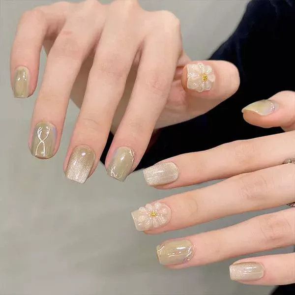 A set of handmade nail studs in various elegant designs, perfect for adding a sophisticated touch to your nail art.