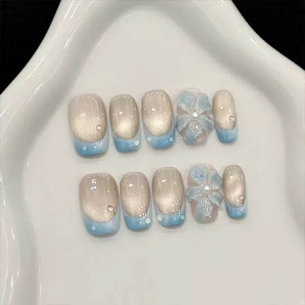 A set of handmade nail studs in various elegant designs, perfect for adding a sophisticated touch to your nail art.