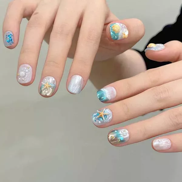 Close-up of custom-made handmade nail studs, designed to elevate the look of your nails with exquisite craftsmanship.