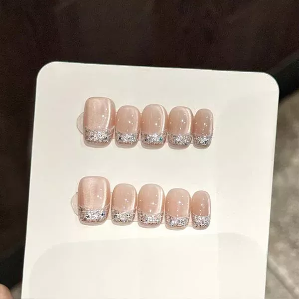 A set of handmade nail studs in various elegant designs, perfect for adding a sophisticated touch to your nail art.