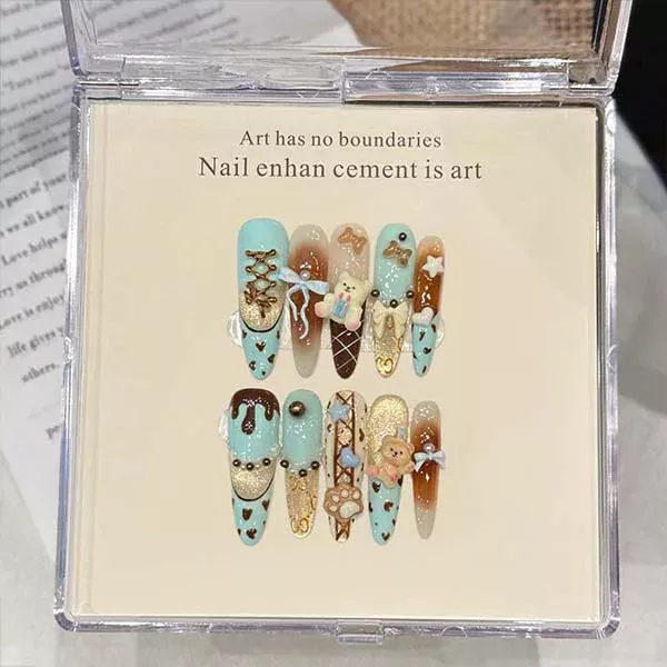 A set of handmade nail studs in various elegant designs, perfect for adding a sophisticated touch to your nail art.